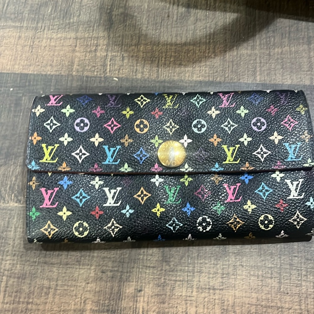 LV Louis Vuitton wallet.  Clean inside with little wear in the coin pocket.